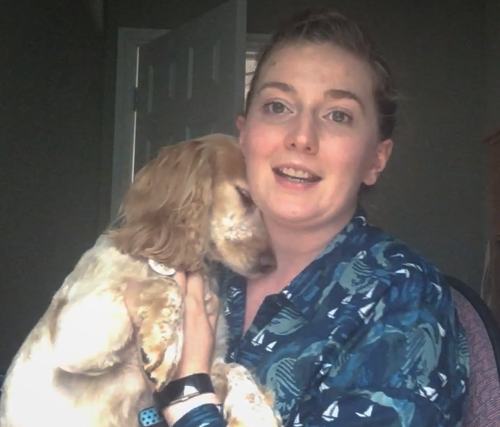 Angela holds her adorable puppy as she talks directly to the camera about the importance of asking for help if you're struggling with fatigue caused by a brain tumour diagnosis.