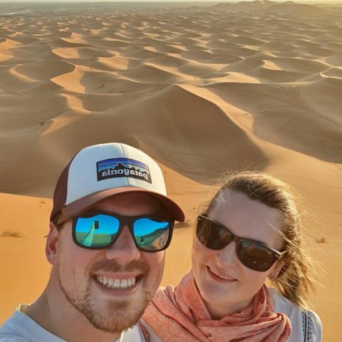 Chantal and Ryan taking a selfie among sand dunes