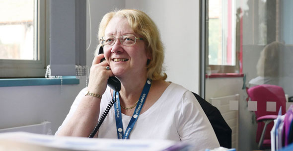 Our experienced Benefits and Money Advisor providing advice over the phone to someone affected by a brain tumour
